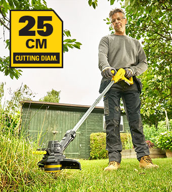 Stanley FatMax V20 SFMCST925 18v Grass Trimmer – 25 cm Cutting Diameter Man using the Stanley FatMax V20 18V cordless grass trimmer with 25 cm cutting diameter on a garden lawn