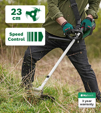 Bosch AdvancedBrushCut 36V-23-750 36V Cordless Brushless Brush Cutter – 23cm Blade, Speed Control, Plant Protector, 3 Year Warranty Bosch AdvancedBrushCut 36V-23-750 36V cordless brush cutter clearing long grass and weeds – 23cm blade, speed control, plant protector, battery status indicator, 3 year MyBosch warranty