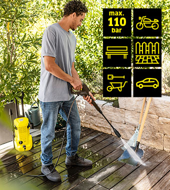 Kärcher K 2 Pressure Washer – 110 Bar, Application Areas Man cleaning decking with the Kärcher K 2 pressure washer: max 110 bar, for bikes, garden furniture, fences, tools and cars