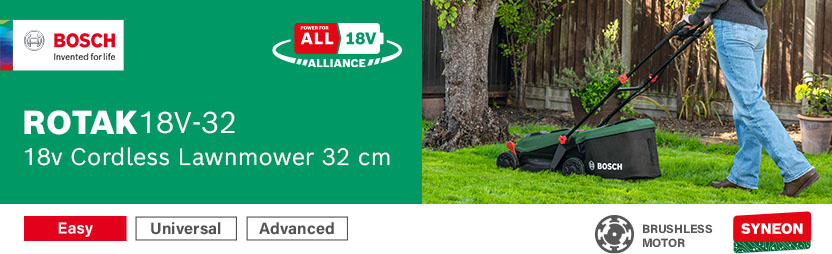 Bosch ROTAK 18V-32 18V Cordless Brushless Lawnmower 320mm – Brushless Motor, Syneon, Power For All 18V Alliance Bosch ROTAK 18V-32 18V cordless lawnmower mowing around a garden tree – brushless motor, Syneon technology, Power For All 18V Alliance compatible