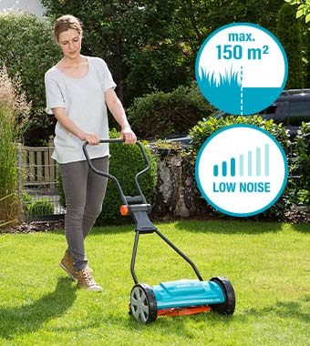 Woman using Gardena Classic 330 hand push cylinder lawnmower in a garden – 33cm cutting width, suitable for lawns up to 150m², low noise – model 4027-20