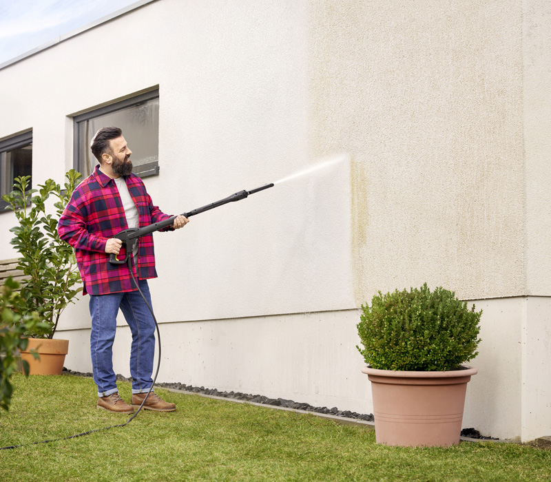 Pressure Washing Rendered Wall